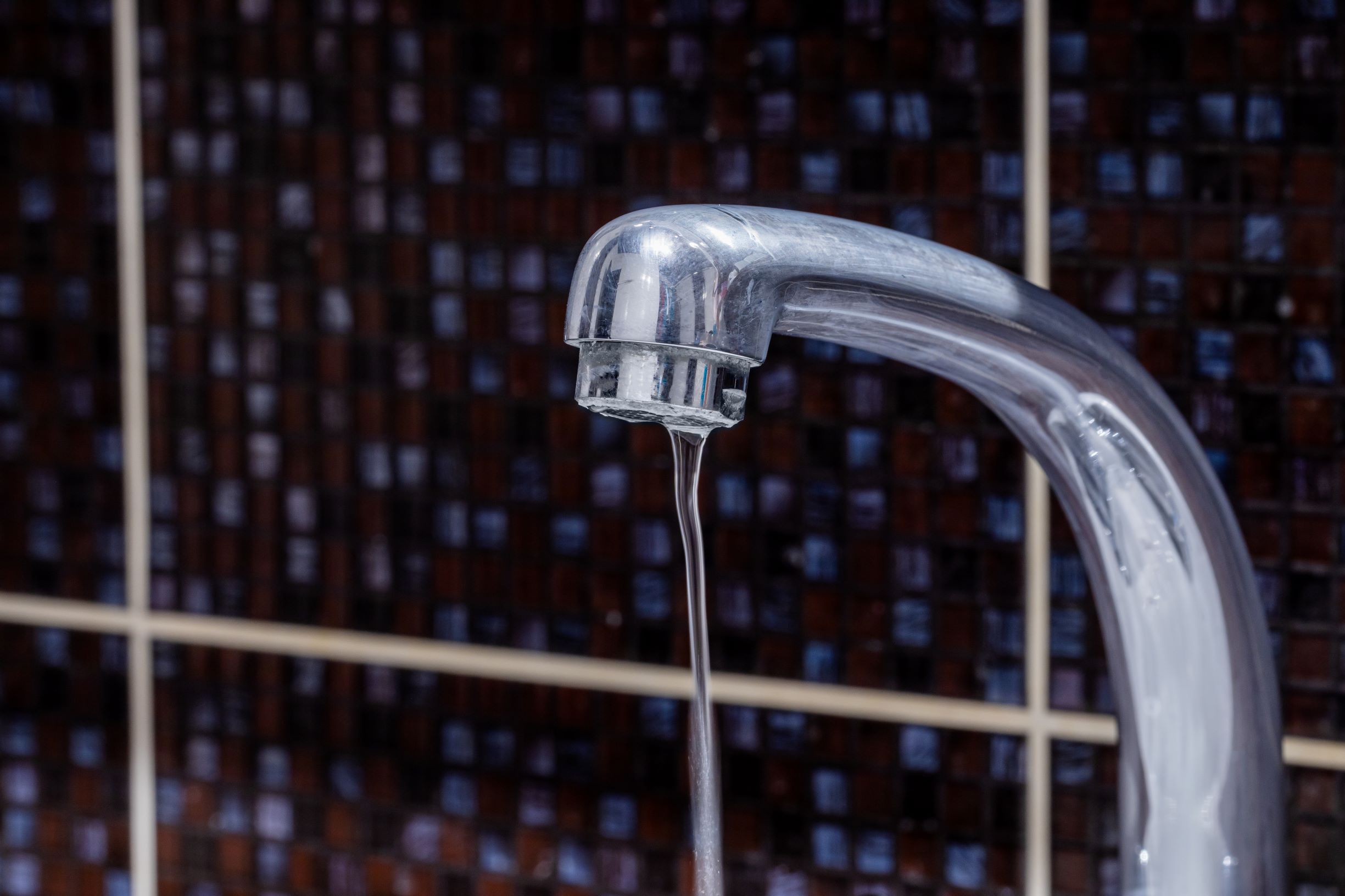 Water pressure running at low temperature to prevent pipes from freezing and bursting