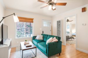 Photo of a house that used to be dusty before cleaning fans carpet and upholstery