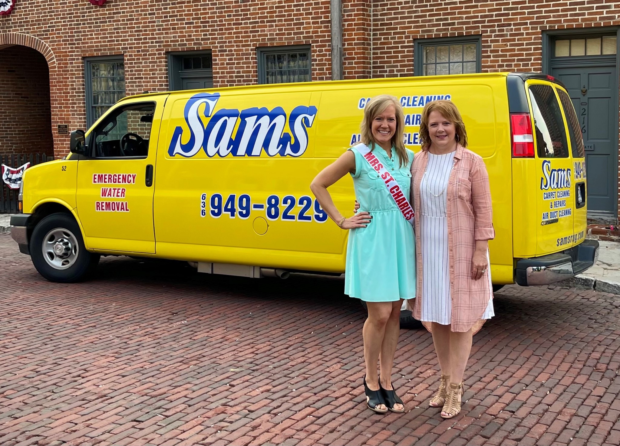 Marcy Bursac and Susan Sams standing in front of a trademark yellow Sams Carpet Cleaning and Repairs van