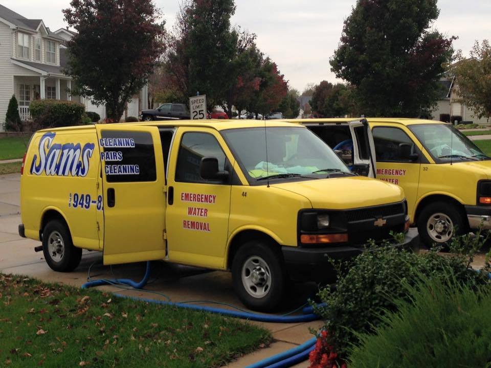 Sams carpet cleaning vans parked in a driveway in St. Louis