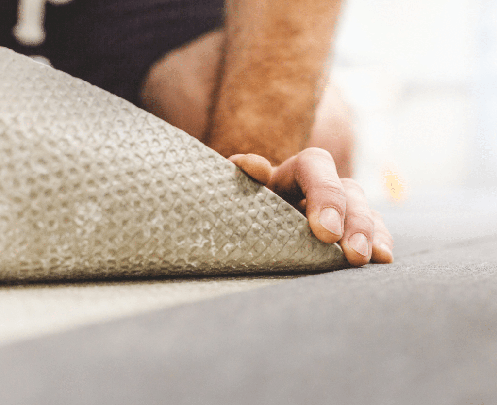 Man Repairing Carpet